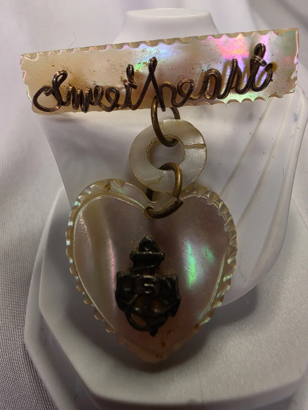 Vintage World War II-era U.S. Navy sweetheart brooch, made from carved MOP